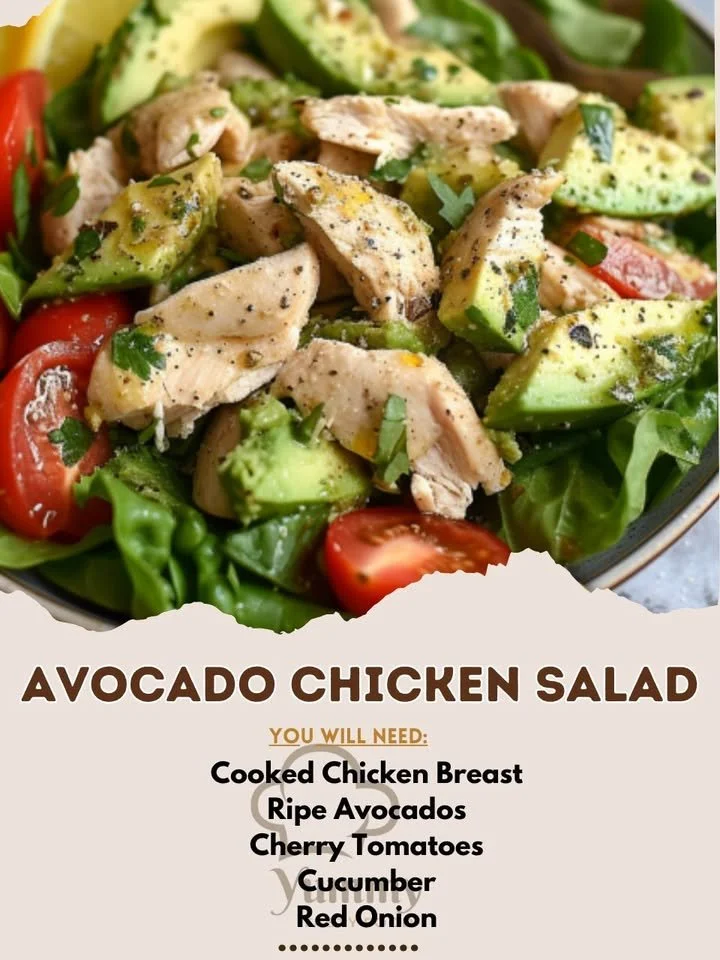 A vibrant bowl of avocado chicken salad with fresh greens and toppings