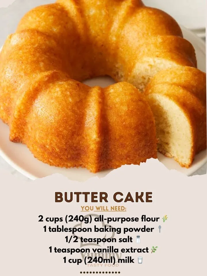 Classic Butter Cake topped with frosting on a white plate