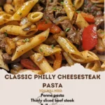 Delicious Classic Philly Cheesesteak Pasta topped with peppers and cheese