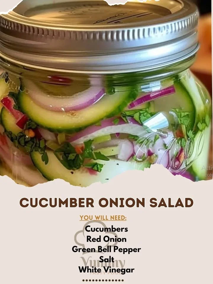 Fresh cucumber onion salad with herbs and dressing served in a bowl.