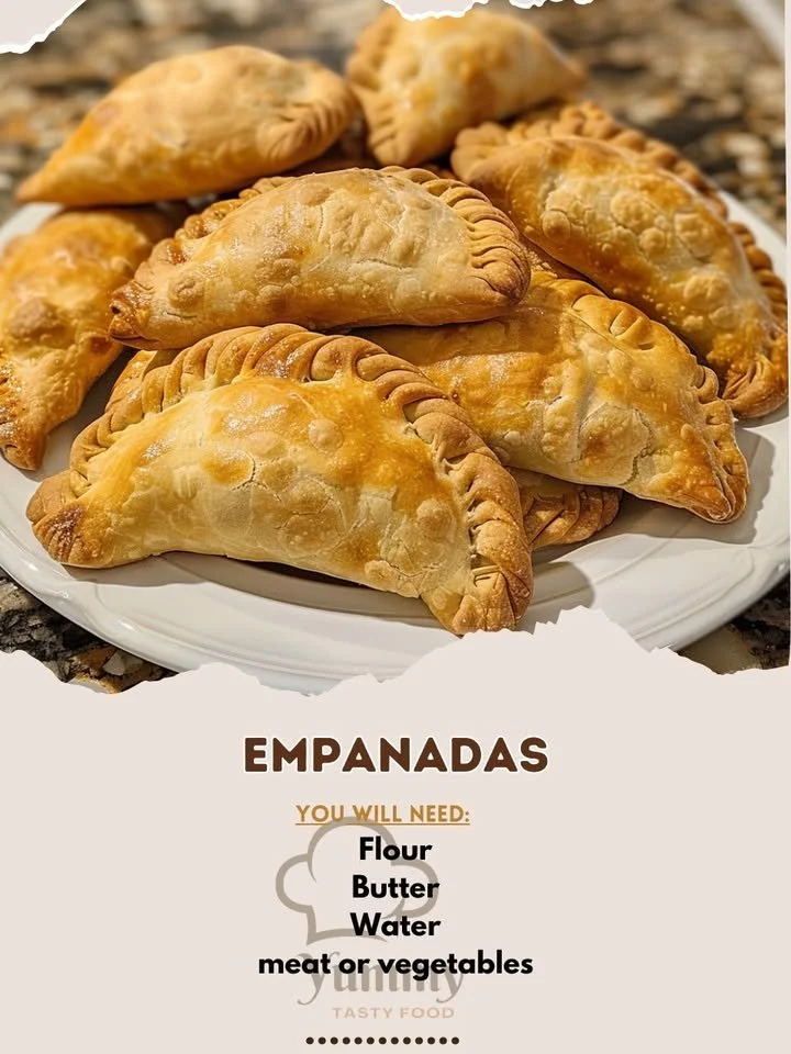 Delicious homemade empanadas with savory fillings on a wooden table.