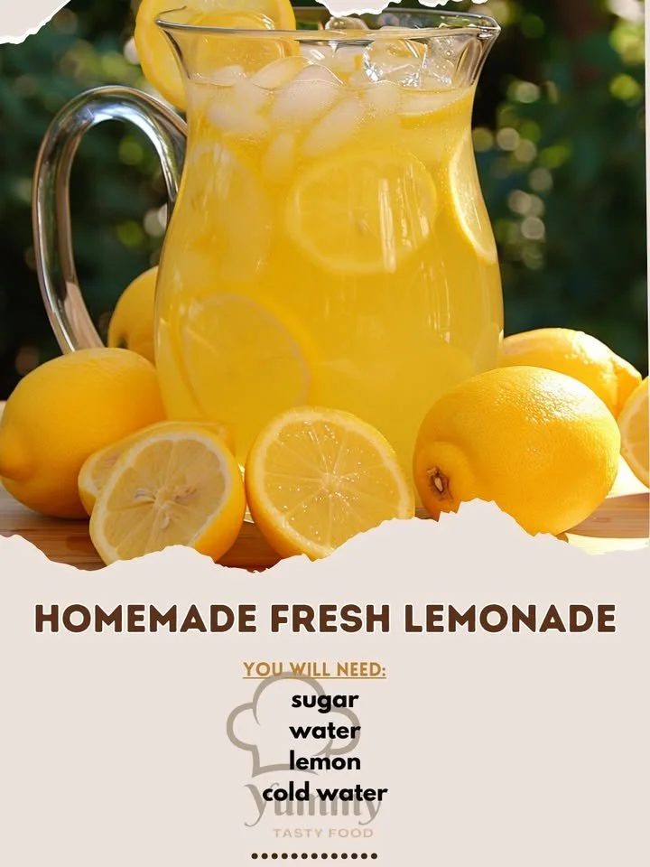Freshly made homemade lemonade in a glass with lemons and mint leaves