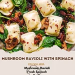 Plate of Mushroom Ravioli with Spinach topped with grated parmesan