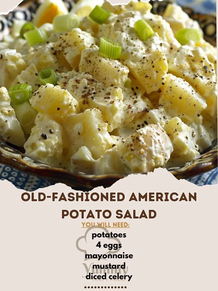 Bowl of Old-Fashioned American potato salad with fresh herbs and vegetables