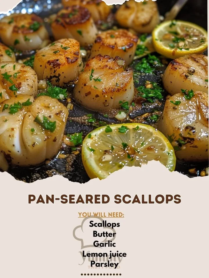 Delicious pan-seared scallops garnished with herbs and lemon