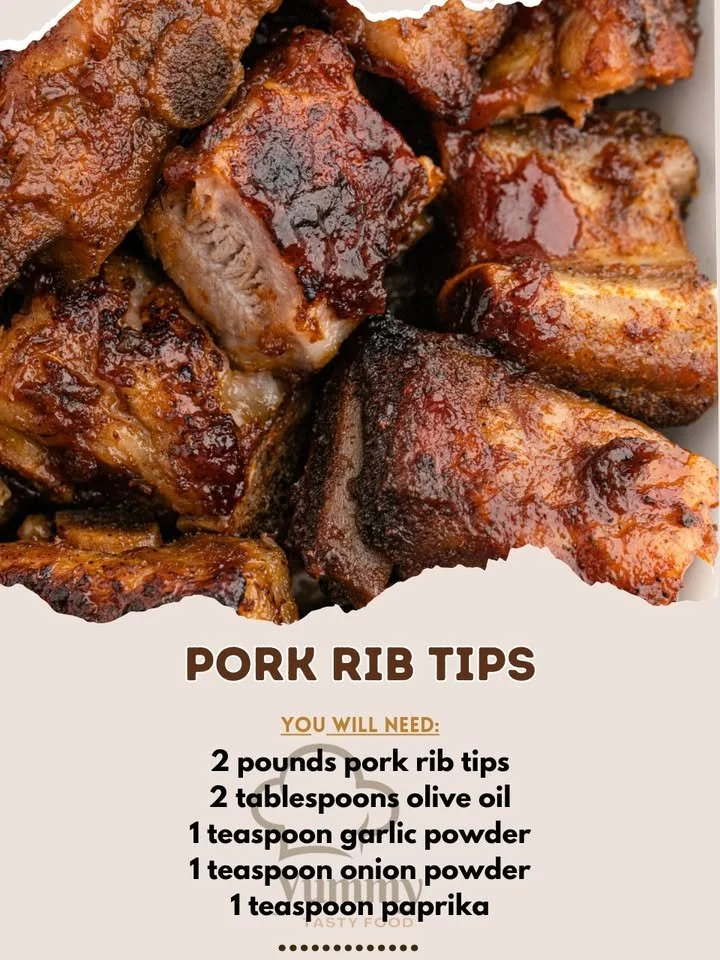 Delicious Pork Rib Tips served on a platter, garnished with herbs.