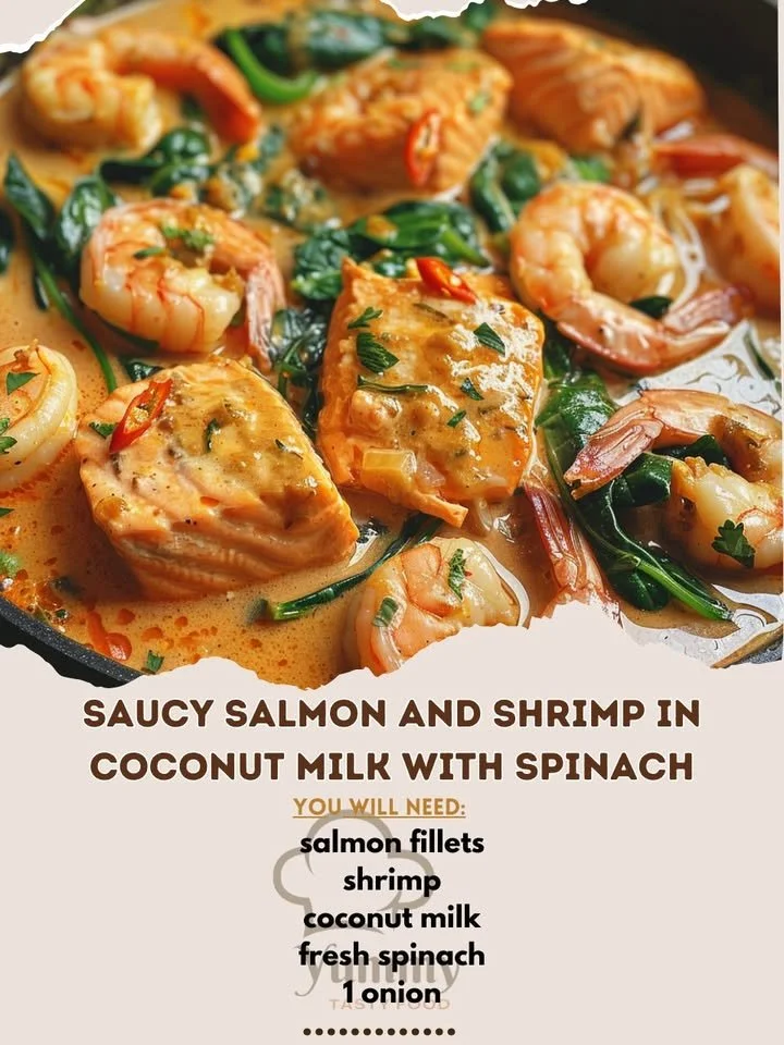 Plate of saucy salmon and shrimp in coconut milk with spinach, a delicious seafood dish