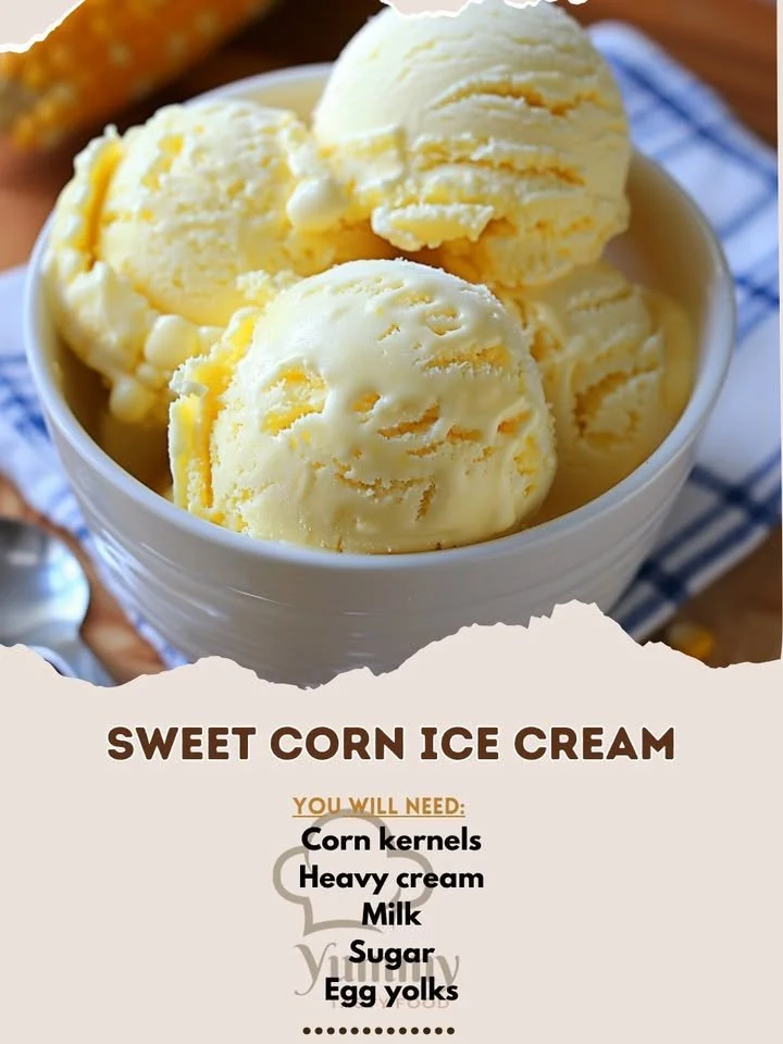 A bowl of sweet corn ice cream topped with fresh corn kernels and mint leaves.