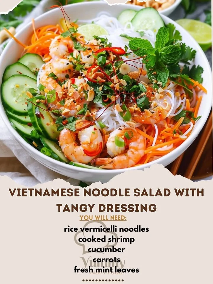 Bowl of Vietnamese Noodle Salad topped with fresh herbs and tangy dressing