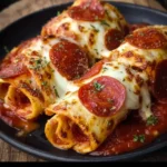 Cheesy pepperoni pizza rolls fresh out of the oven, golden and crispy snack