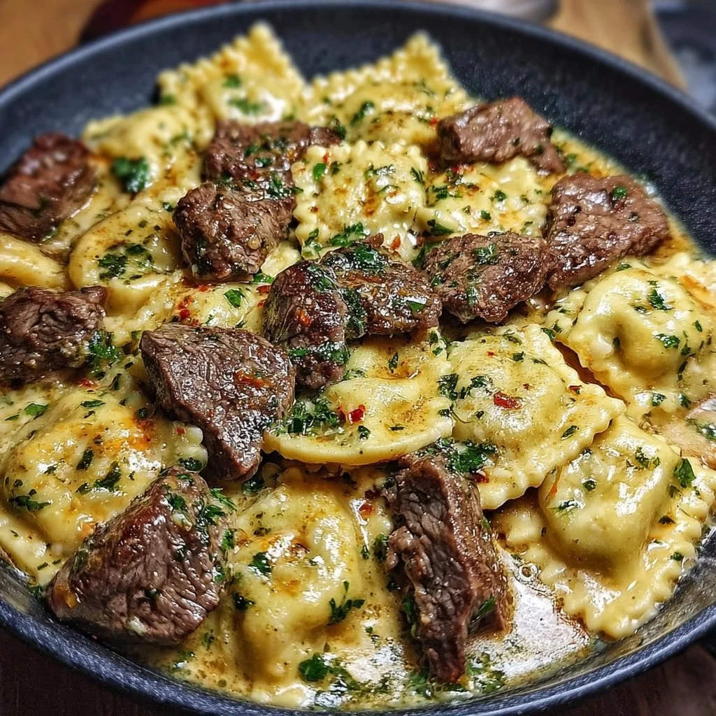 One-Skillet Garlic Butter Steak served with Cheese Ravioli in a skillet.