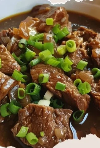 Delicious Beef Pares served with a side of rice and herbs, a traditional Filipino dish.
