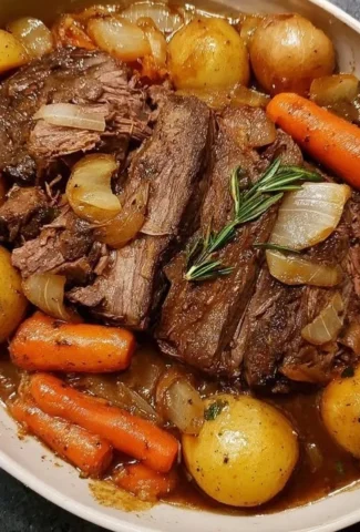 Delicious slow-cooker pot roast served with vegetables and herbs