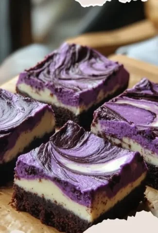 Delicious ube cheesecake brownies on a plate.